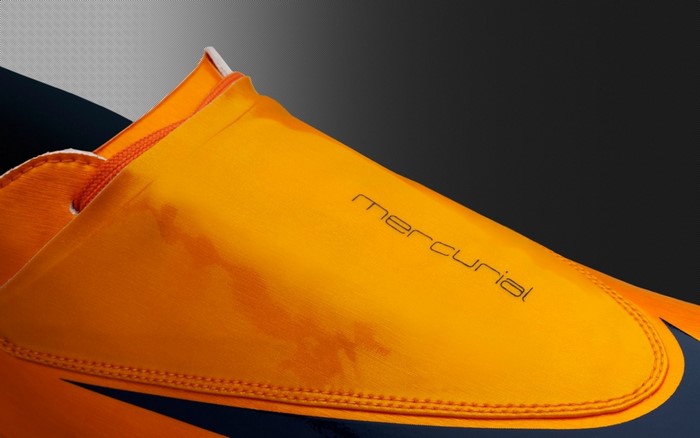 Nike Mercurial orange soccer cleat close-up