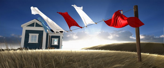 Laundry on a clothesline in front of a house