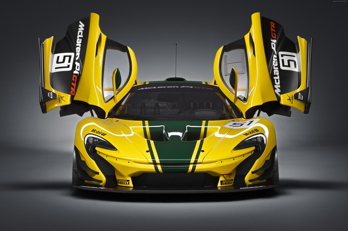 Yellow McLaren P1 GTR race car with doors open
