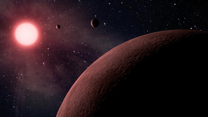Red dwarf star with planets in space
