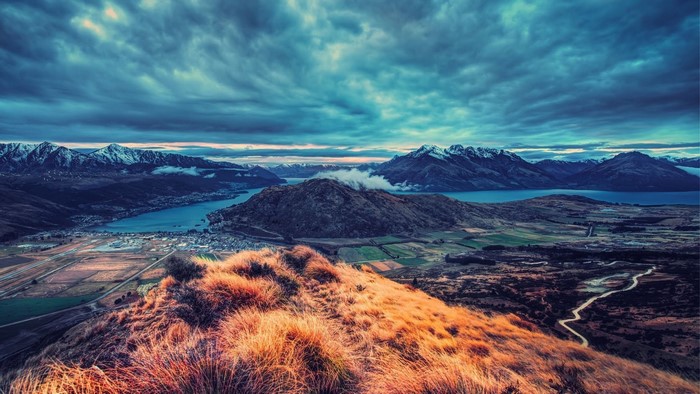 Aerial view of mountains and a lake at dawn