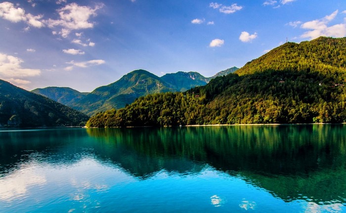 Lake and mountains with forest reflection