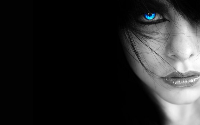 Close up of a woman's face with blue eyes
