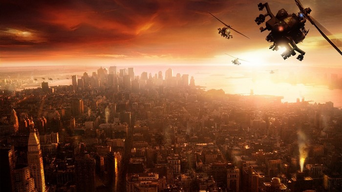 Helicopters flying over a city at sunset