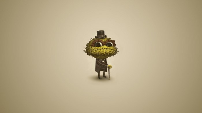 Green fuzzy character in a suit and top hat