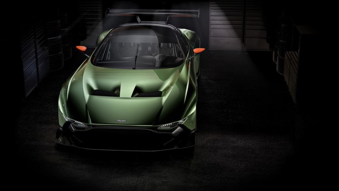 Green Aston Martin Vulcan race car in garage