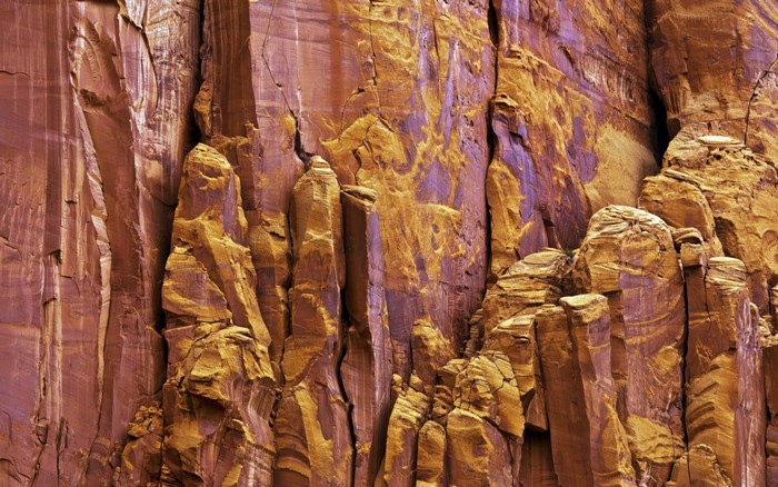 Orange and purple rock formation in a canyon