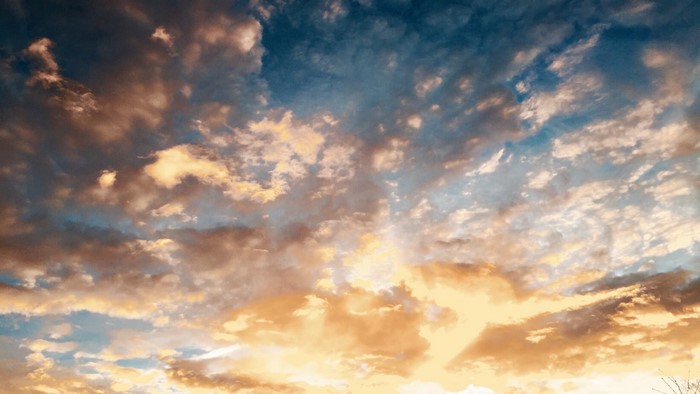 Sunset clouds with golden and blue hues