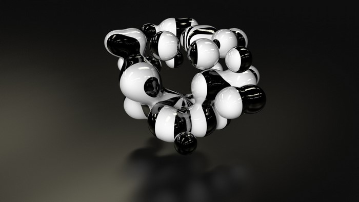 Abstract black and white spheres in a circle