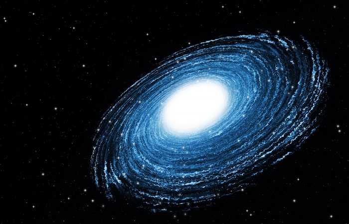 Blue spiral galaxy in outer space with stars