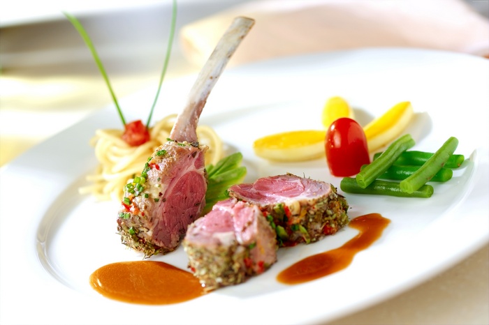 Rack of lamb with spaghetti and vegetables