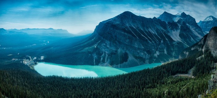 Turquoise Lake Surrounded by Mountains and Forest