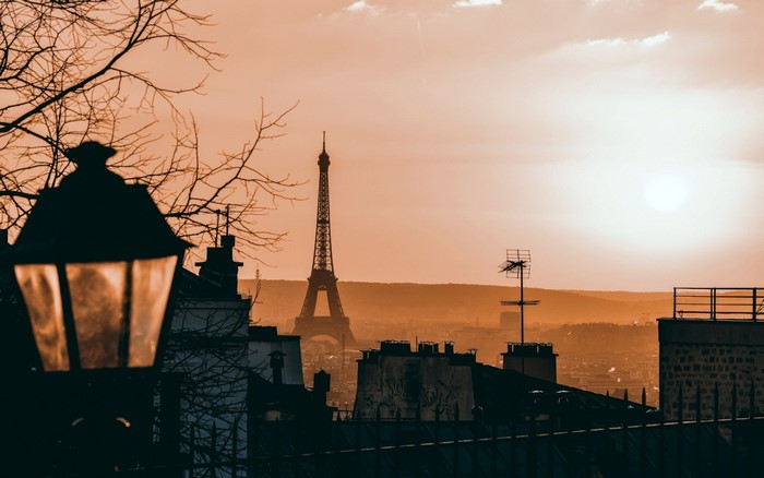 Eiffel Tower cityscape at sunset with lamppost