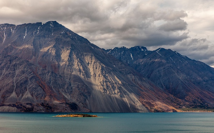 Mountain range overlooking a lake with an island