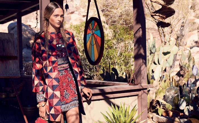 Model in patterned outfit in desert setting