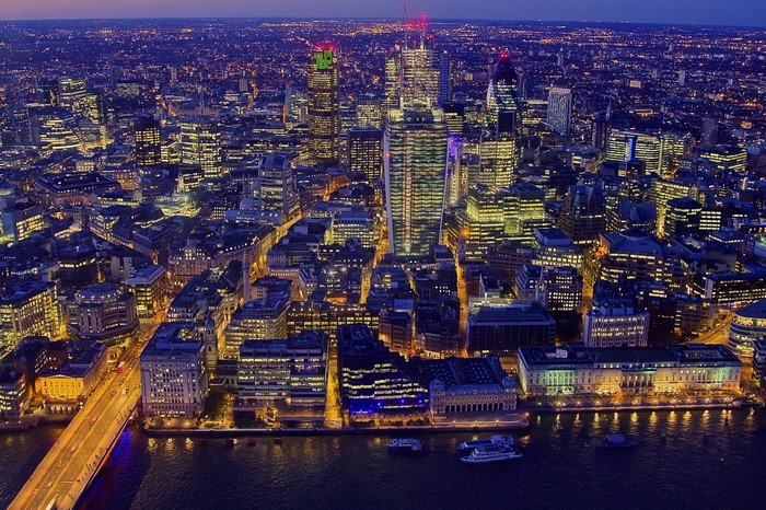 London cityscape at night with the River Thames
