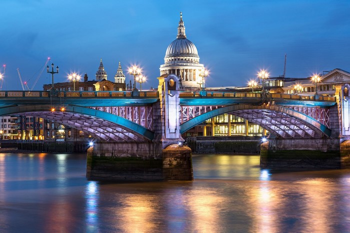 London cityscape at night with St. Paul's Cathedral and bridge