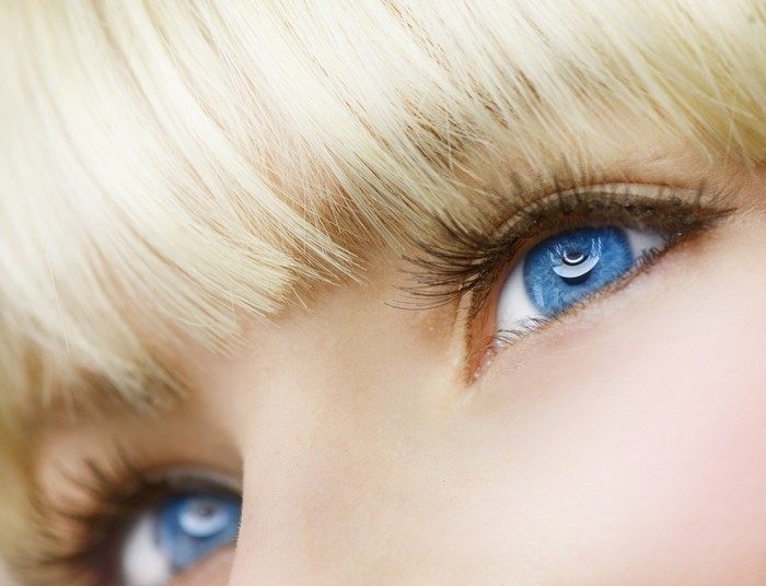 Close up of a person with blue eyes and blonde hair