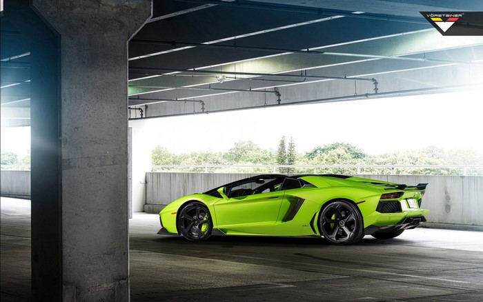 Lime green Lamborghini Aventador convertible with Vorsteiner wheels