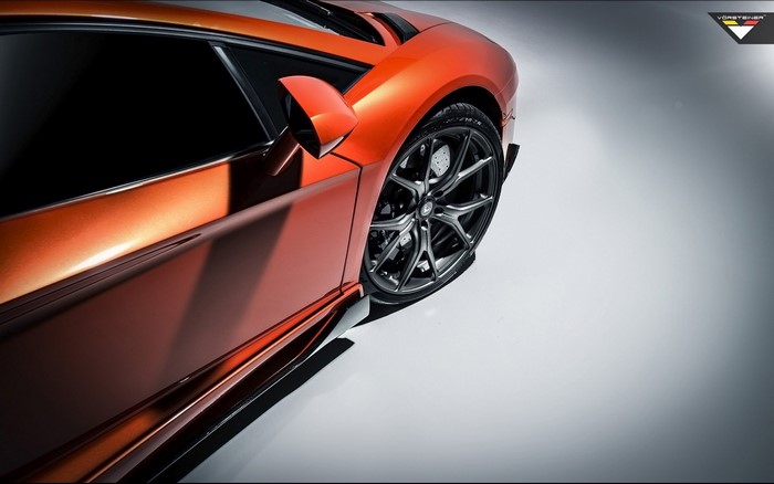 Orange Lamborghini Aventador with Vorsteiner wheels