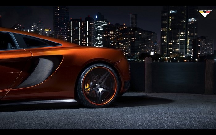 Orange McLaren MP4 VX by Vorsteiner at night