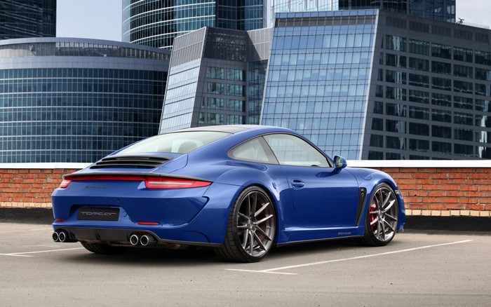 Blue Porsche 911 Stinger by TopCar with modern buildings