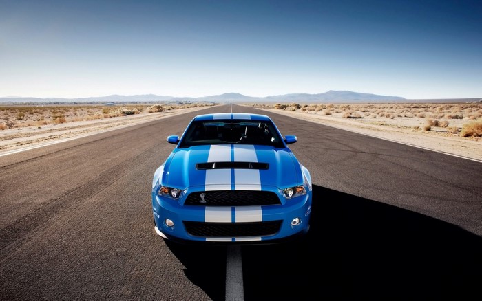Blue Shelby GT500 Mustang on a desert road