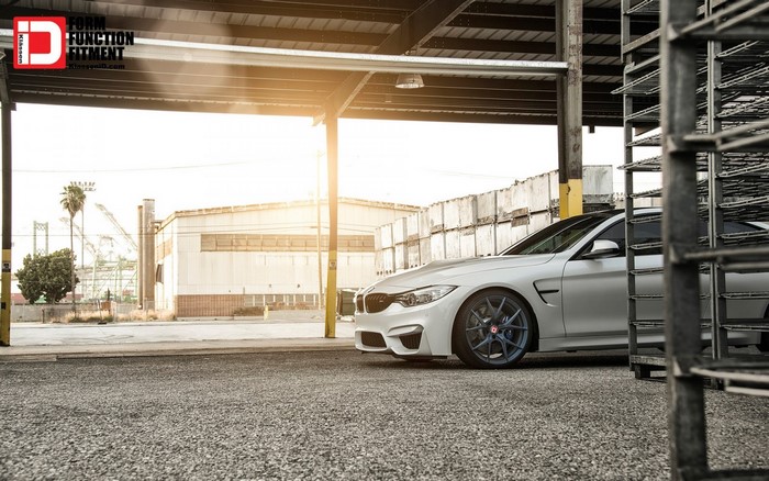 White BMW M4 with custom wheels
