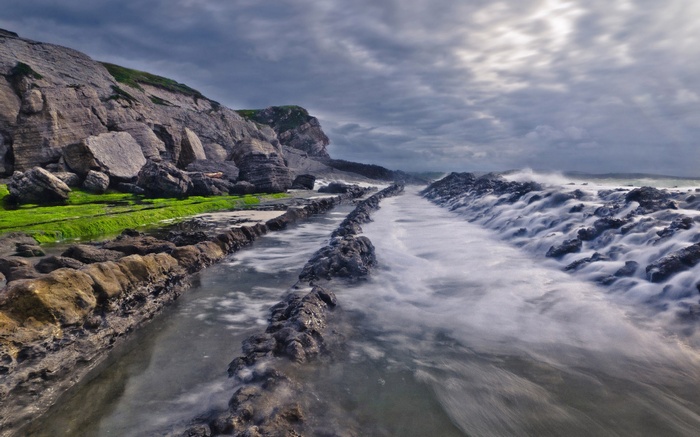 Rocky coastline with waves crashing on shore