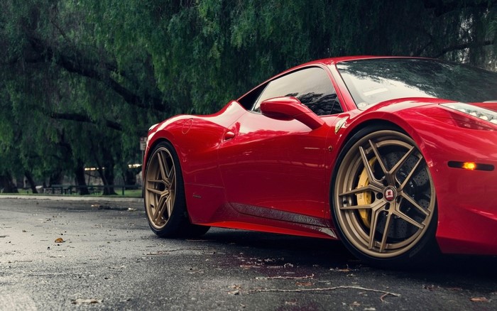 Red Ferrari 458 Italia with gold wheels