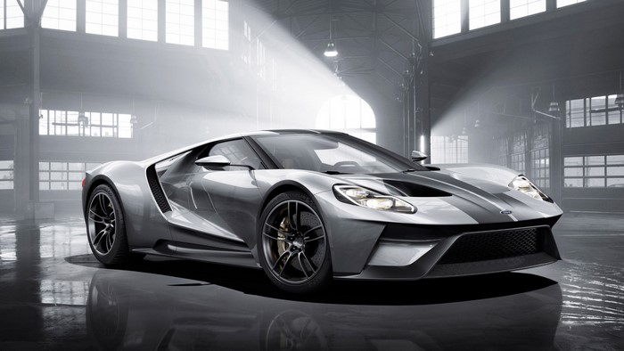 Silver Ford GT sports car in a warehouse