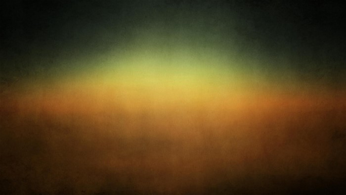 Abstract gradient of dark green, yellow, and orange