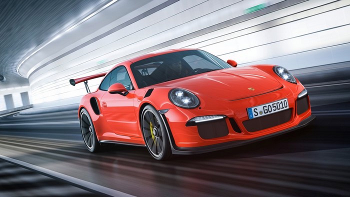 Red Porsche 911 GT3 RS driving in a tunnel