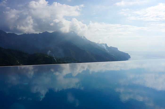 Infinity pool overlooking mountains and sea, Hotel Caruso, Italy
