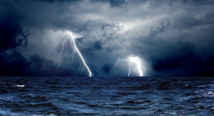 Lightning strikes over a stormy ocean