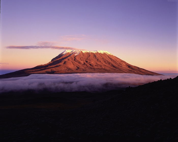 Mount Kilimanjaro at sunrise with clouds