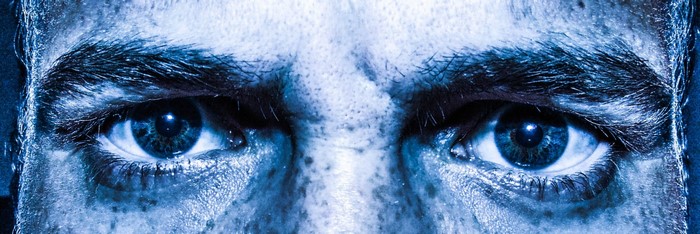 Close up of a man's intense blue eyes