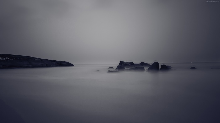 Sea rocks in fog 4K