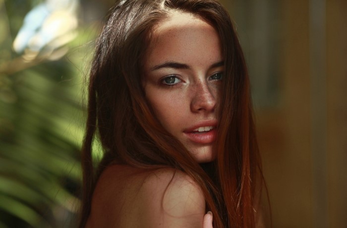 Portrait of Woman with Long Brown Hair and Freckles