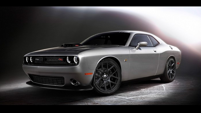 Silver Dodge Challenger SRT Hellcat parked on a textured surface