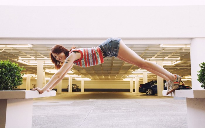 Woman in short shorts doing a plank pose