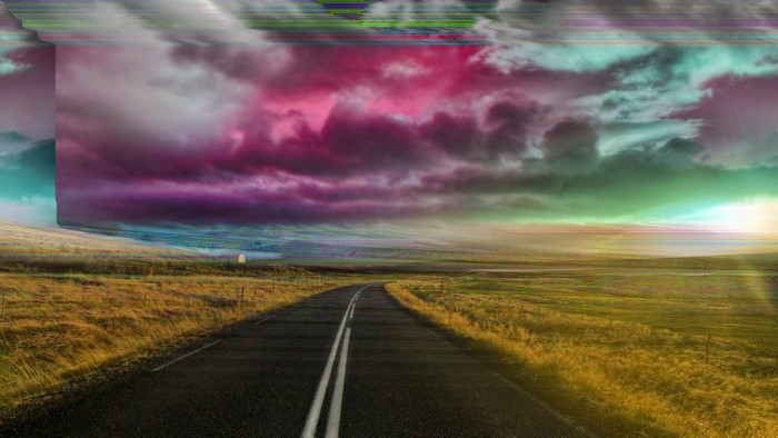 Glitch art road through a colorful, stormy sky