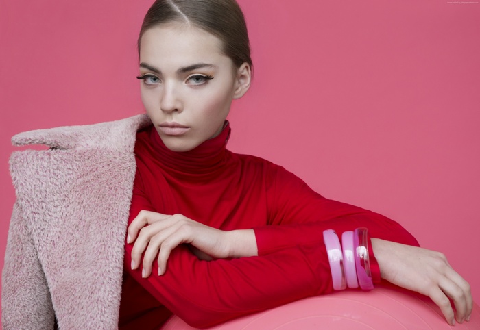 Kasia Bielska in red turtleneck and pink coat
