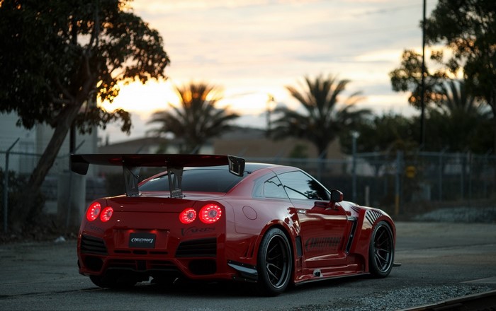 Red Nissan GT-R with a large rear spoiler