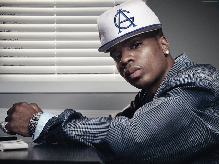 Rapper Plies wearing a white and blue cap and suit