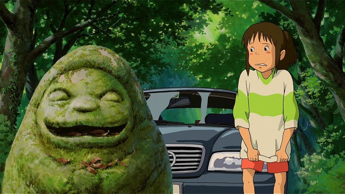 Chihiro from Spirited Away next to a mossy statue and car