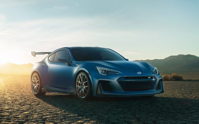 Blue Subaru WRX STI concept car in desert landscape