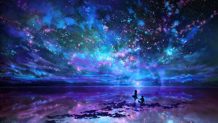 Couple watching a galaxy over the sea