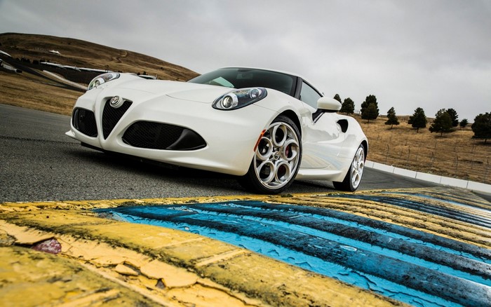 White Alfa Romeo 4C on a Racetrack