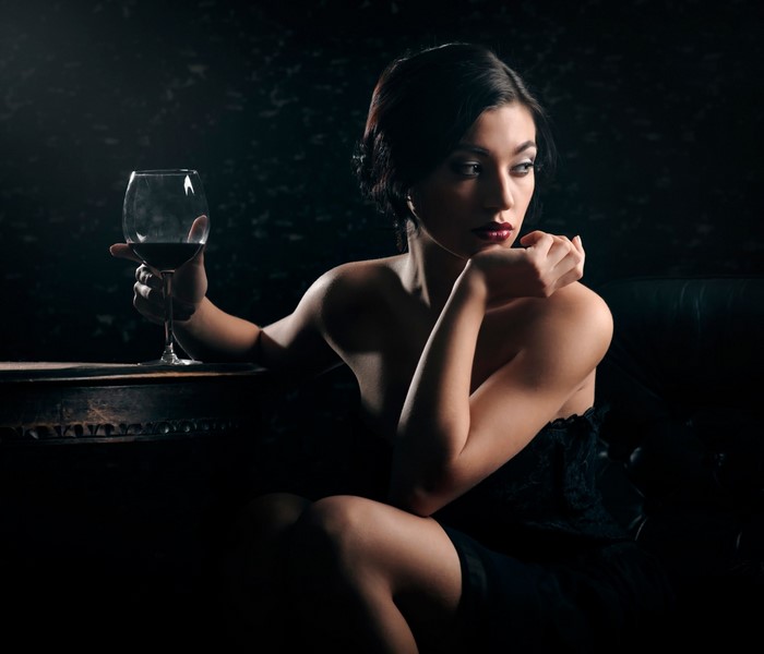 Woman holding a glass of red wine